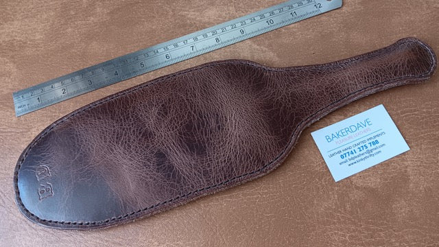 Brown Buffalo Hide Leather Paddle. Shiny and stressed look.