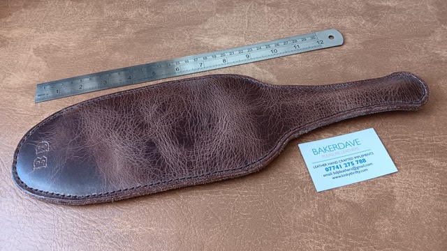 Brown Buffalo Hide Leather Paddle. Shiny and stressed look.